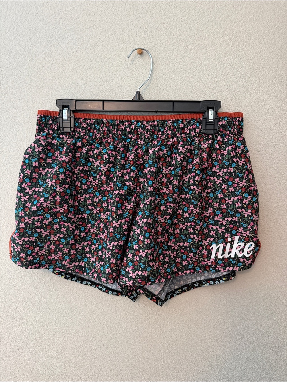 Nike Women’s Black Floral Athletic Shorts with Pink & Teal Accents